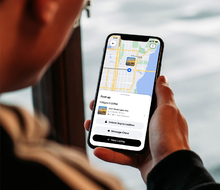 Home-showing scheduling app on mobile device, with listing and Unlock Supra Lockbox button